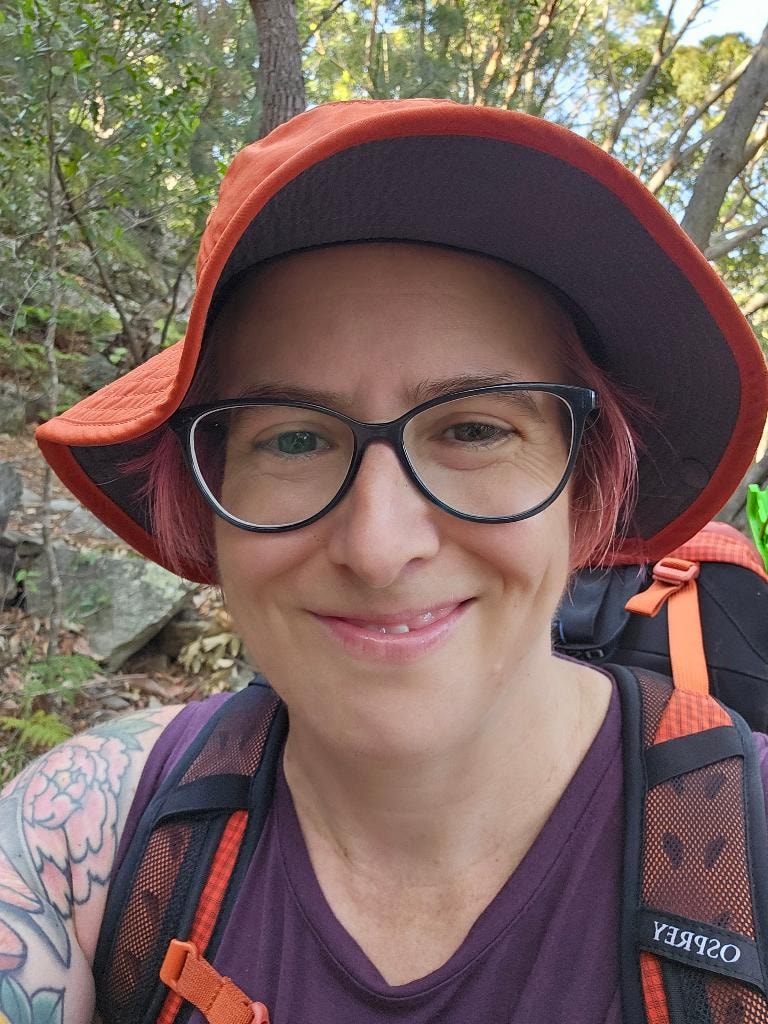 Dr Mara Hickey on a bush hike with backpack